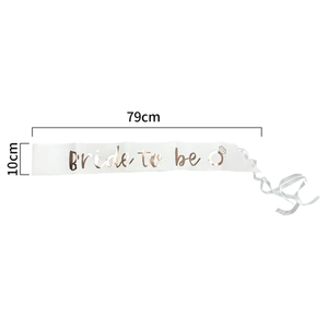 Rose gold and white "Bride To Be" sash from Trademart, perfect for bridal costumes, featuring elegant lettering and satin finish.