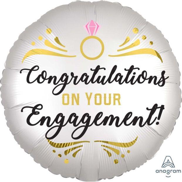 Shiny satin silver engagement foil balloon with "Congratulations" message, branded by Anagram, floating against a plain background.